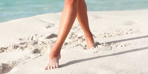piernas mujer playa
