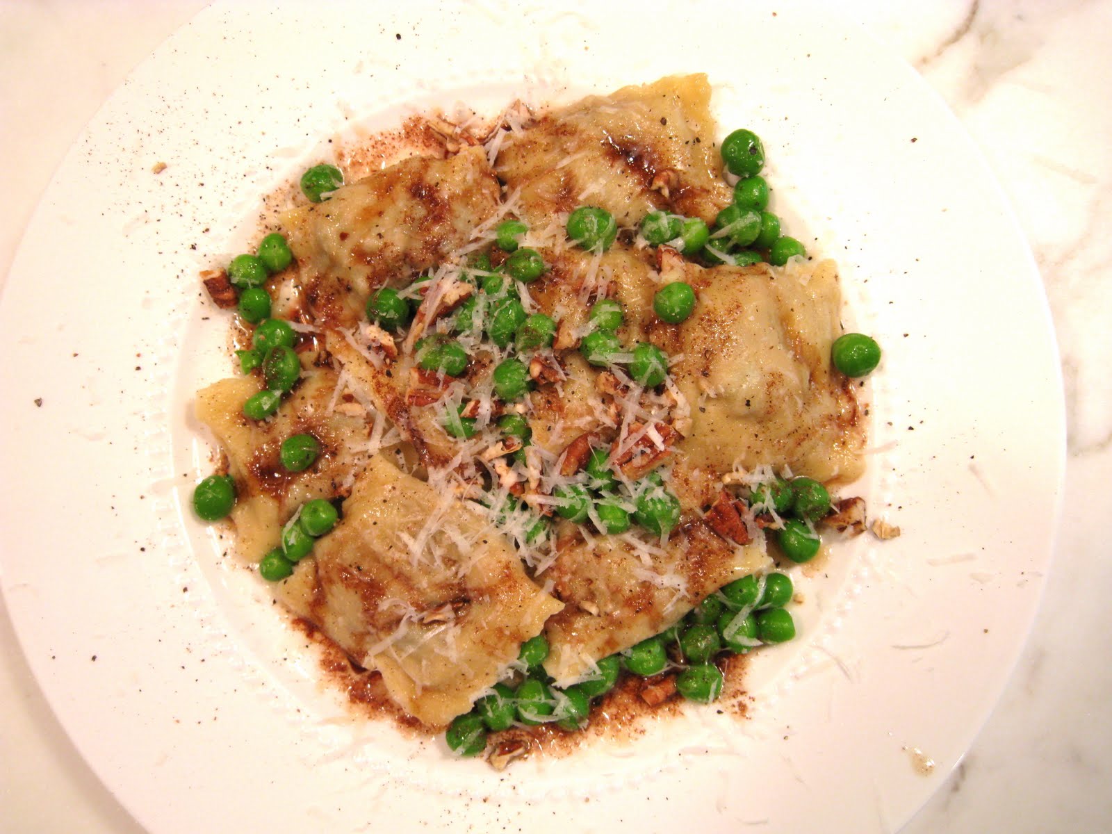 Veal, Portobello Mushroom and Carrot Ravioli with Browned Butter and Fresh English Peas