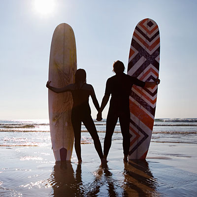 surfing couple handholding 400x400 - Fun Ways to Keep Fit with Your Partner
