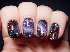 Purple galaxy nail art by @chalkboardnails