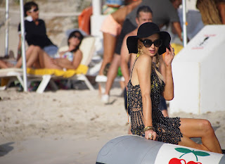 Paris Hilton strikes a pose on a boat with cherry sticker