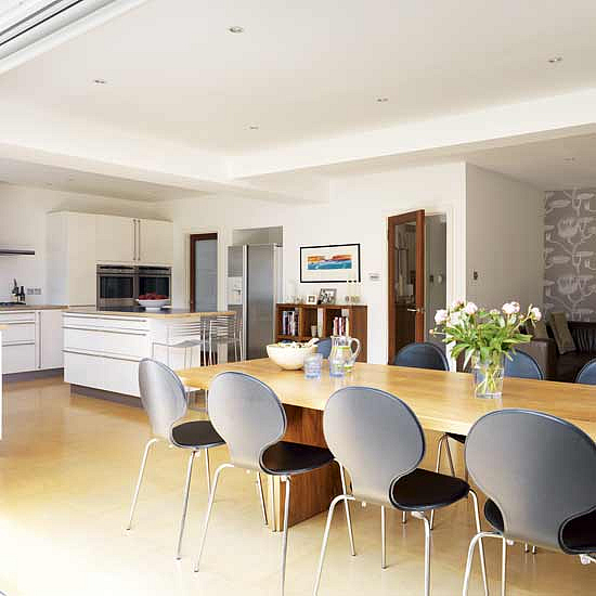 the bespoke kitchen has rounded detailing and a large belfast sink and