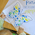 Pintar mariposas simétricamente.
