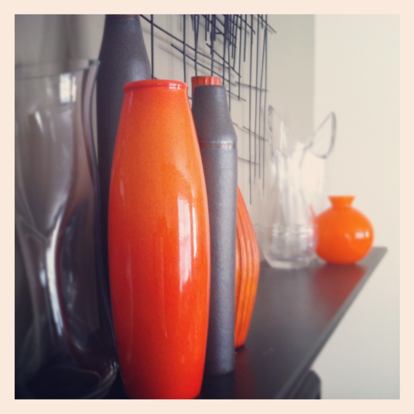everywhere orange Orange vase on mantle