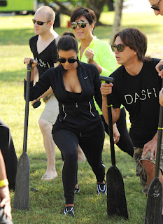 Kim Kardashian stretching at the park