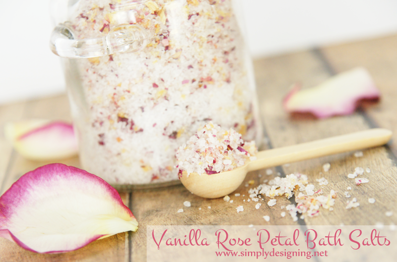 Spoon of bath salts blended mixed with bits of real rose petals and vanilla fragrance