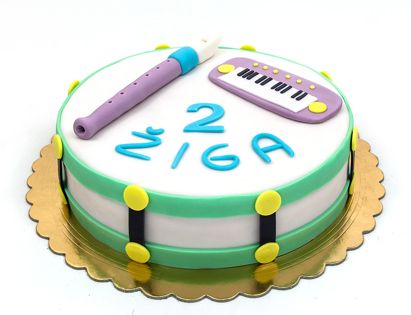 Music instruments fondant cake flute, drums and piano close