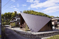Origami House Design with A-Frame in an Old Village Surrounded by Mountains Origami House Design with A-Frame in an Old Village Surrounded by Mountains