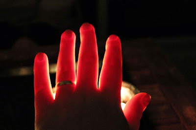 Female hand in the candle light