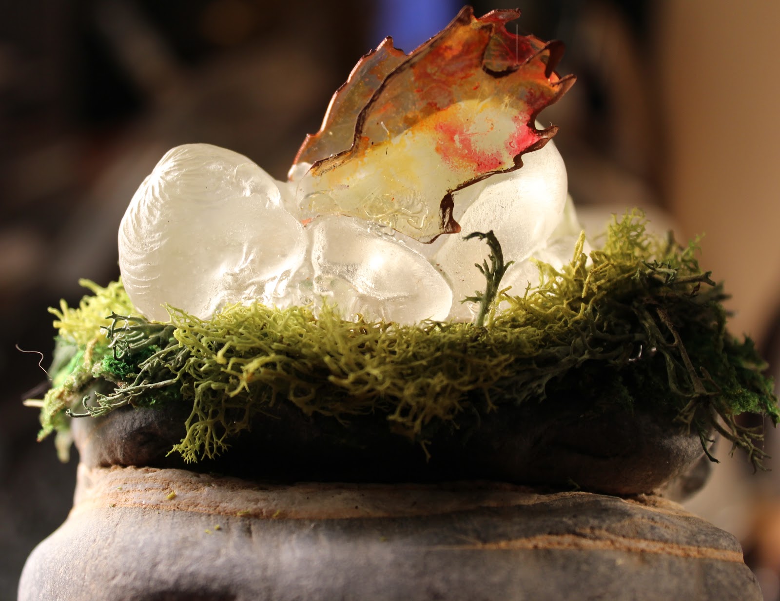 JuJu Crafts Elemental Baby Fire Fairy Paperweight in Moss Nest on Rock