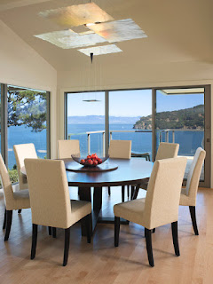 Black Round Dining Tables for Various Dining Room Designs Appealing Blue Sea View near Dining Room with Round Dining Tables and Cozy Chairs on Hardwood Floor
