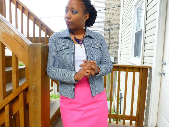 blue eyeshadow on black african american skin and pink pencil skirt