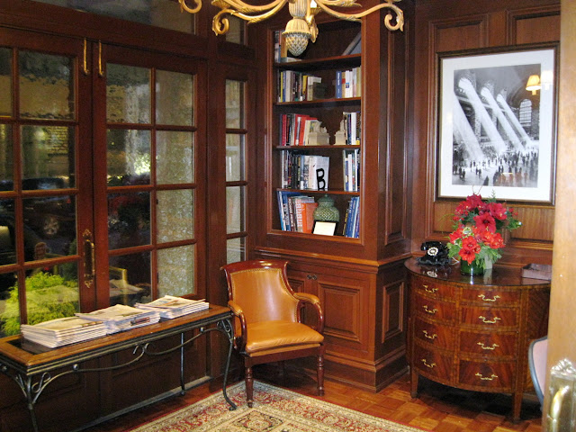 It's near impossible not to relax with a cup of warm apple cider and the newspaper inside the New York Library at the Iroquois Hotel