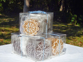box of dark-chocolate tea biscuits, box of decorated gingerbread cookies, box of honey-vanilla cookies