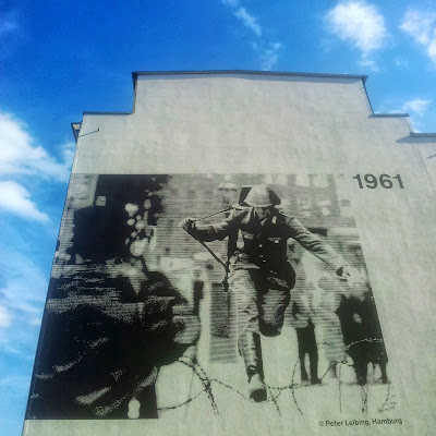Defecting East German soldier, Hans Conrad Schumann, Jumps from East to West at the Bernauer Street sector  in Berlin