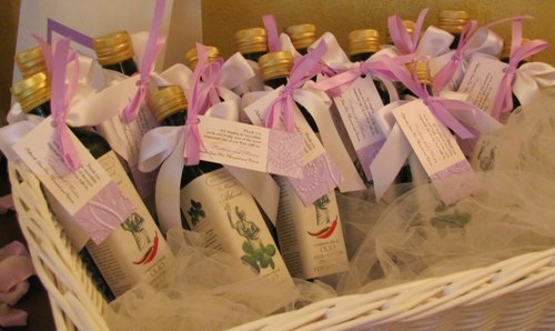  and bottles of olive oil both decorated in the wedding theme colour
