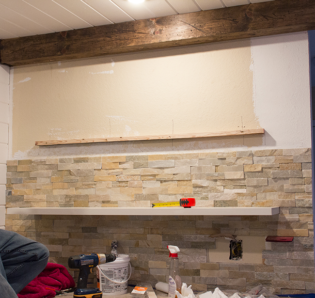 Stacked Stone Kitchen with Floating Shelves