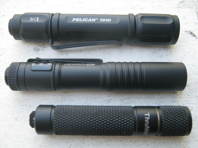 Peclican 1910 AAA Flashlight shown with Streamlight Microstream and Thrunite Ti Peclican 1910 AAA Flashlight shown with Streamlight Microstream and Thrunite Ti
