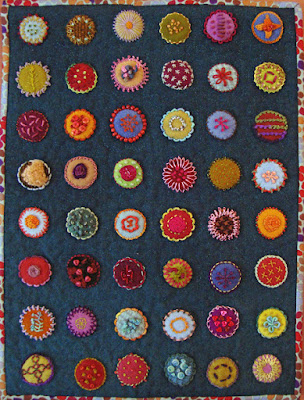 Circles, a wall quilt by Glenys Baker, embroidery on wool applique