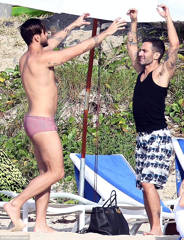 Marc Jacobs' ex-fiance Lorenzo Martone sports Louis Vuitton trunks and  matching towel as he stretches on the beach