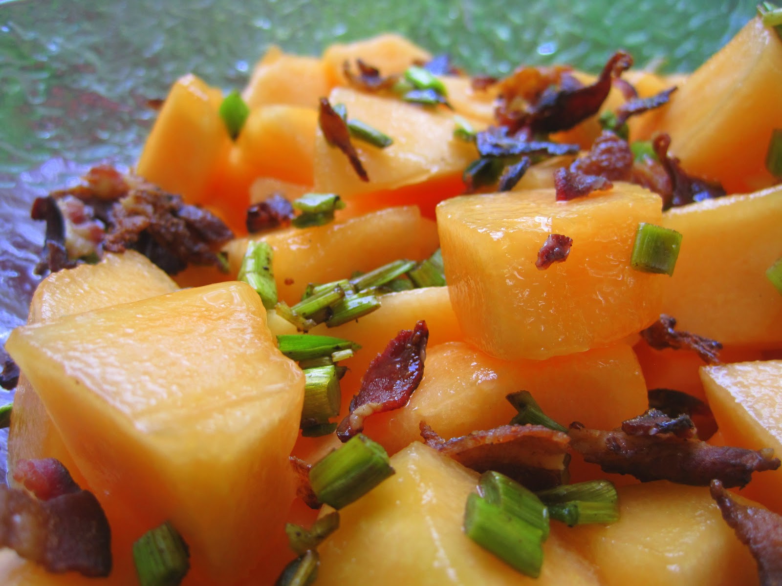 Cantaloupe Salad with Bacon and Garlic Scapes