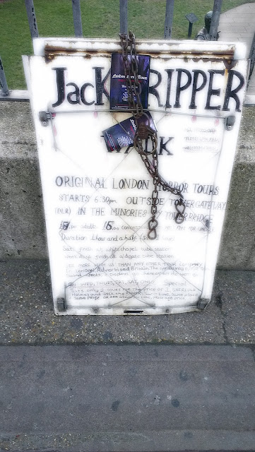 Image of the Jack the Ripper Tours sign from Tower Hill station in london