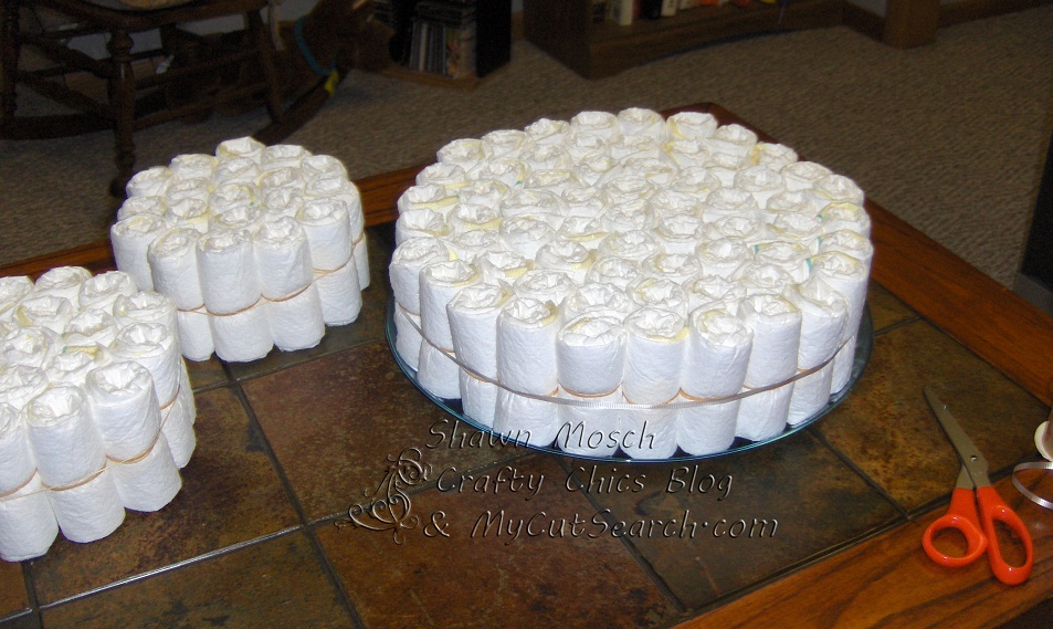 Crafty Chic's Diaper Cake building the tiers