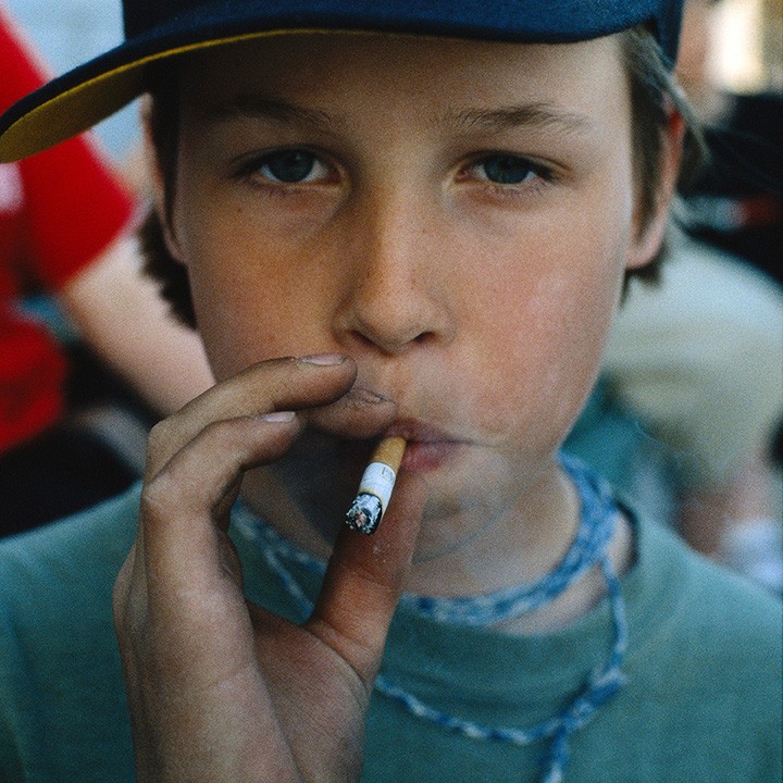 Teen smokes cigarette then sticks