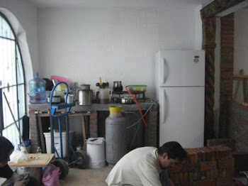 José Francisco constructing the Island Counter with the untiled counter in the background.