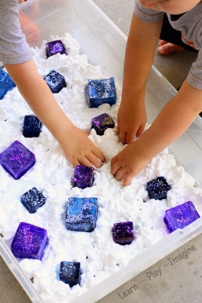 Frozen inspired sensory play with shaving cream and ice.