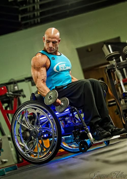 Man with muscular upper body, lifting hand weights, while sitting in purple wheelchair, lit up underneath