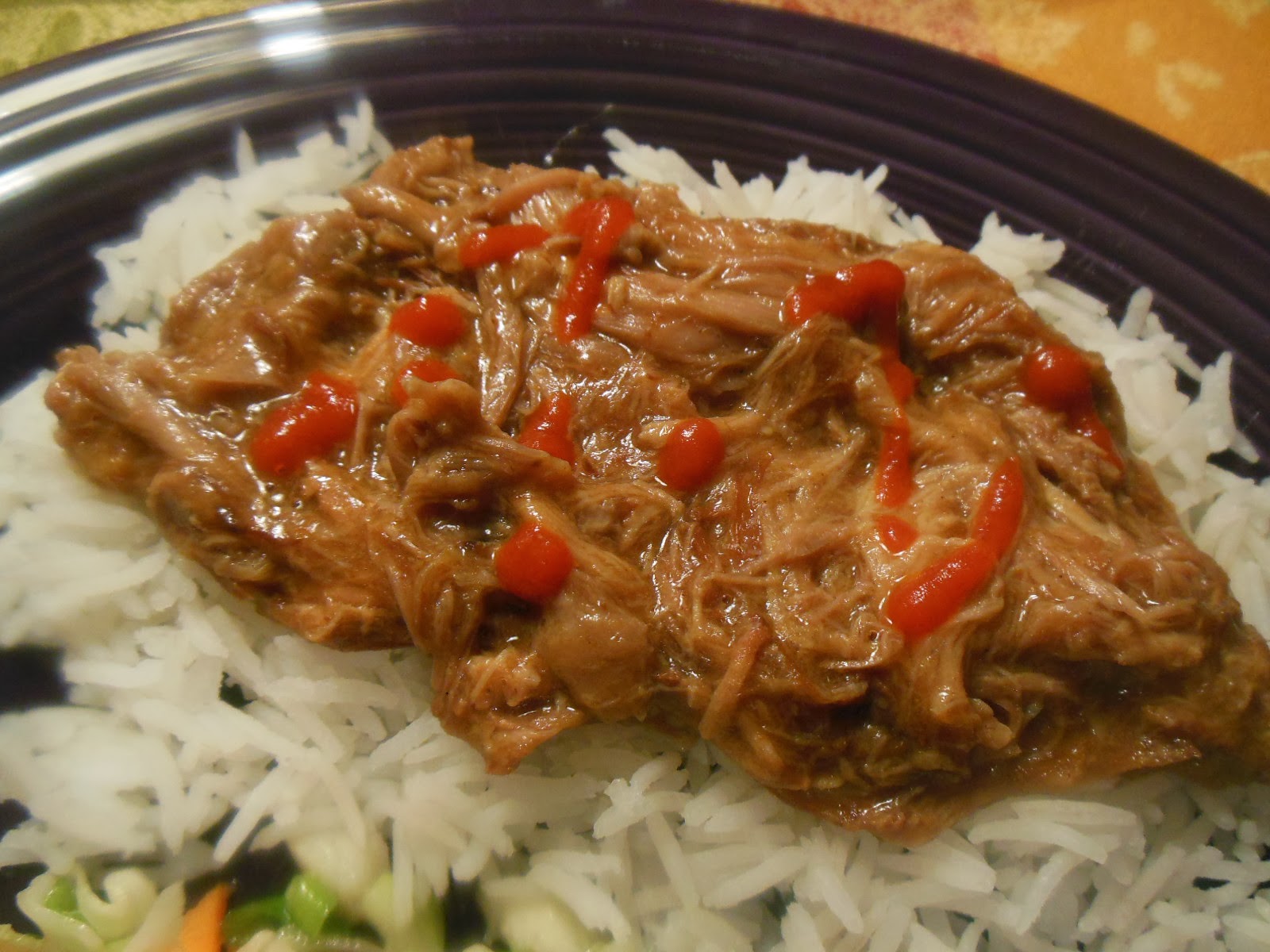 Fleur de Lolly Asian Pulled Pork with Gravy served over Rice