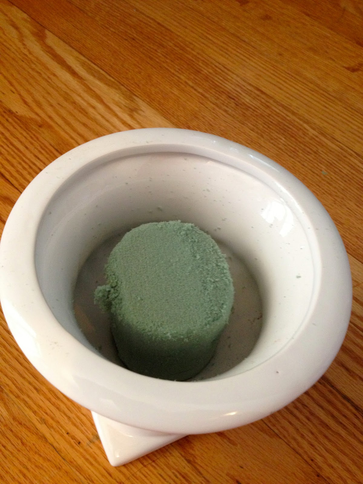 Two It Yourself DIY Toilet Paper holder from a planter and a dowel