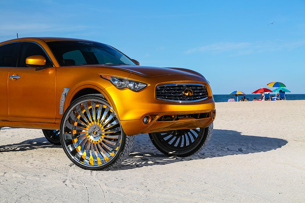 Ghetto style Gold Infiniti FX crossover SUV gets huge custom chrome Wheels