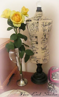 yellow roses in a bud vase