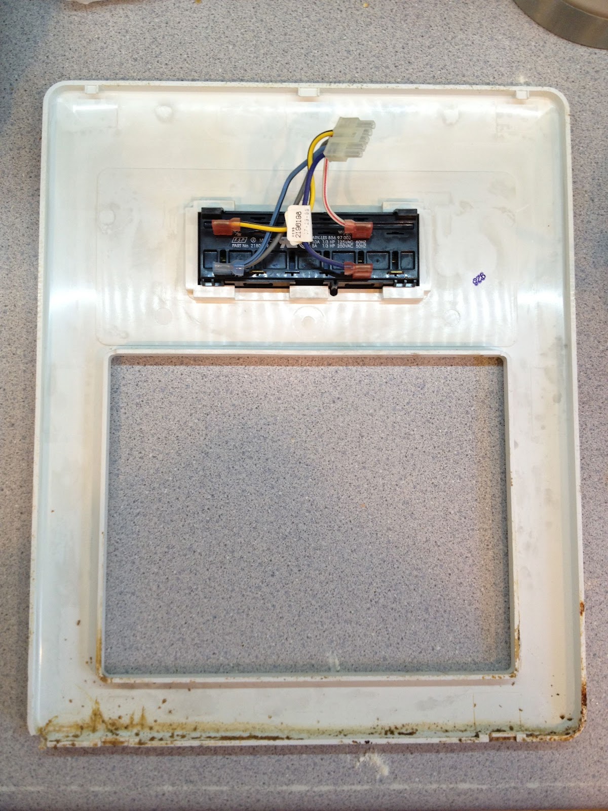 How to Remove the Control Panel Bezel on a Kenmore Coldspot Model