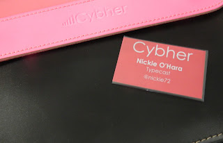 Cybher speaker badge and pink leather branded satchel