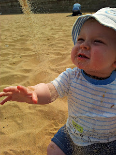 catching sand, 9 month old baby at the beach, Ramsgate