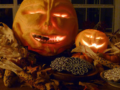 carved pumpkin with dark-chocolate tea biscuits and gingerbread cookies