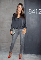 Alessandra Ambrosio strrikes a pose in tight jeand and red heels at The NARS 8412 Melrose Boutique opening party red carpet