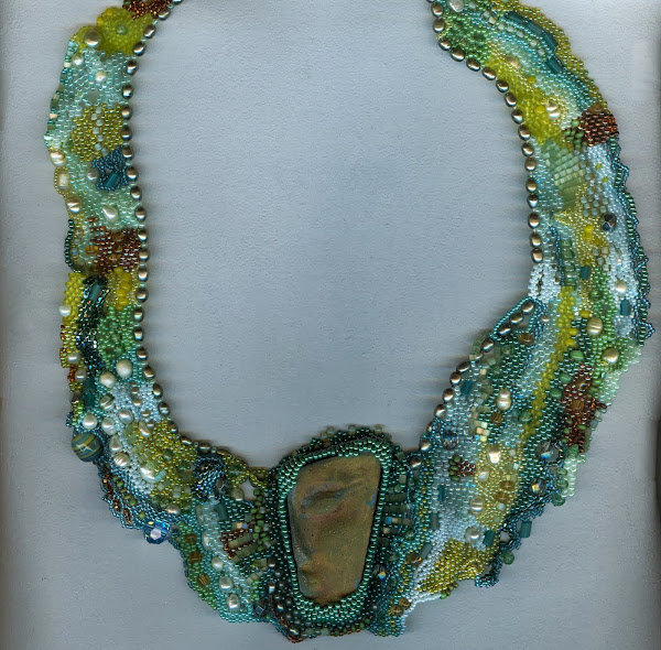 Necklace with hand made RAKU bead Shades of green