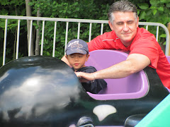 Alexandre and Dad going on a ride at Storyland