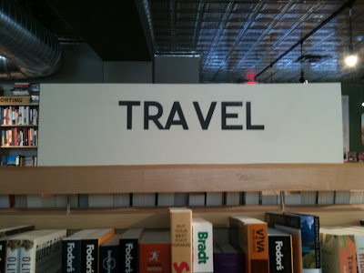 TRAVEL section sign with huge space between the A and V so it looks like TRA VEL