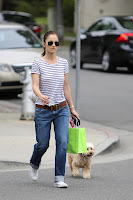 Minka Kelly and  her dog Chewy crossing the street