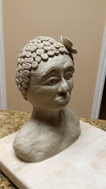Ceramic pottery sculptural bust of negro woman, in progress.