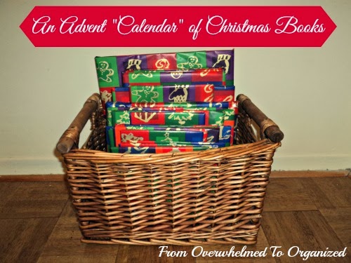 Basket of books wrapped in Christmas themed paper.