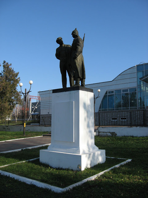 Historical monument stands in front of the station