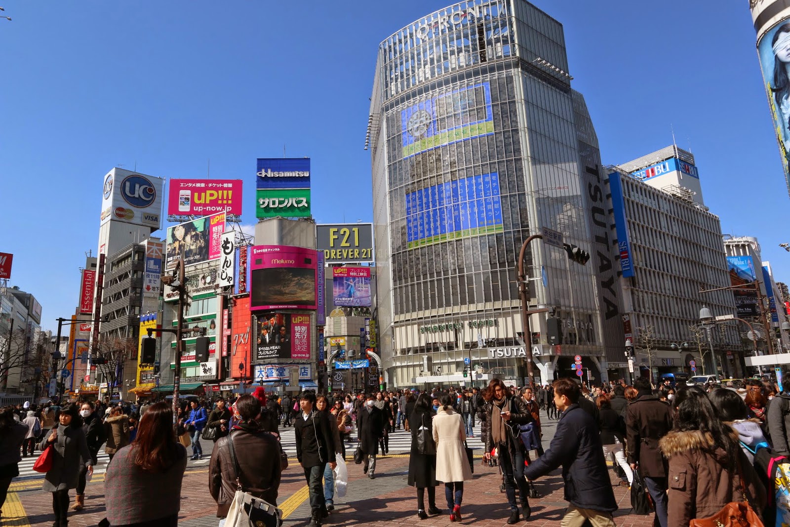 It was the moment of pedestrian crossing at the large intersection in front of Shibuya Station of Tokyo, Japan It was the moment of pedestrian crossing at the large intersection in front of Shibuya Station of Tokyo, Japan
