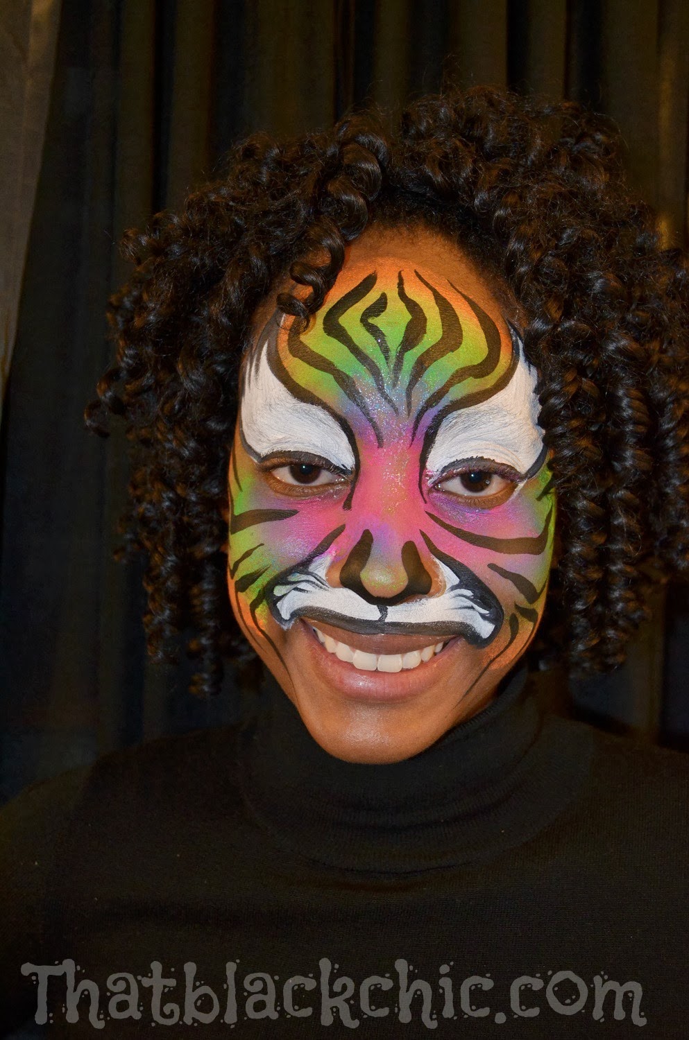 Giving back by volunteering Face Painting the kiddies That Black Chic