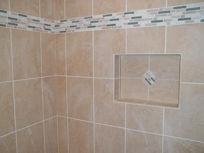 Frameless tile niche uses matching accent "diamond" inset